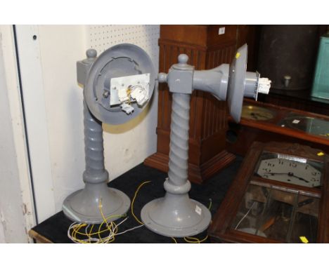 A PAIR OF LARGE PAINTED METAL WALL MOUNTED LAMP BASES
