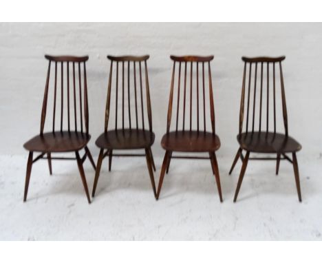 SET OF EIGHT ERCOL ELM DINING CHAIRS
each with a shaped top rail above a stick back, with shaped seats standing on shaped tur