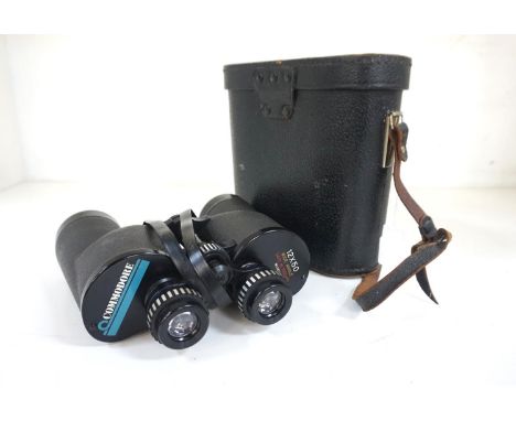 PAIR OF COMMODORE FIELD GLASSES
with 12x50 magnification and numbered 90138, with a black leather carry case, together with a