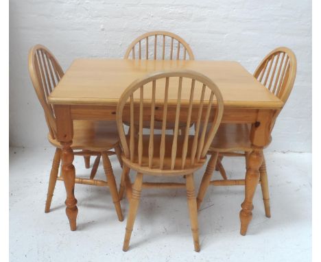 BEECH FARMHOUSE STYLE TABLE
with a moulded top, standing on turned supports, 107cm wide, together with four beech hoop stick 