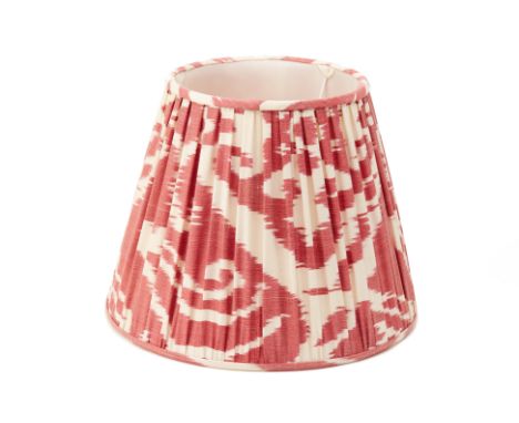 A RED IKAT SILK LAMP SHADE
the shade pleated
28cm x 36cm
Condition: Minor signs of wear commensurate with age and use - small