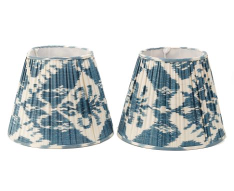 A PAIR OF BLUE SILK IKAT LAMP SHADES
Pleated
28cm x 36cm
Condition: Minor signs of wear commensurate with age and use.