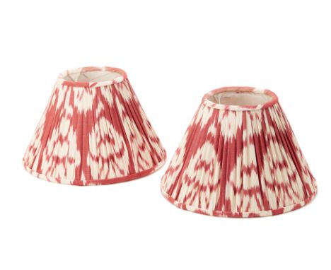 A PAIR OF SMALL RED SILK IKAT LAMP SHADES
the shades pleated
17.5cm high x 28.5cm diameter
Condition: Minor signs of wear com