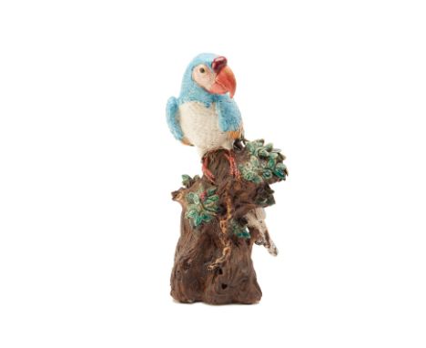 A LARGE POTTERY MODEL OF A PARROT
Modelled perched on a tree trunk
43cm high
Condition: Minor signs of wear commensurate with