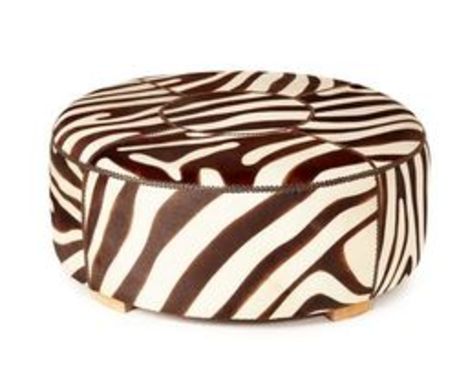 A LARGE CIRCULAR ZEBRA PRINT COWHIDE OTTOMAN
A large 1 meter diameter ottoman or side table 
Zebra printed patchwork cowhide 