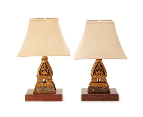 A PAIR OF BRASS LAMPS ON WOODEN BASES
the lamp base decorated with a detachable wooden gilt plinth fashioned from Laotian loo