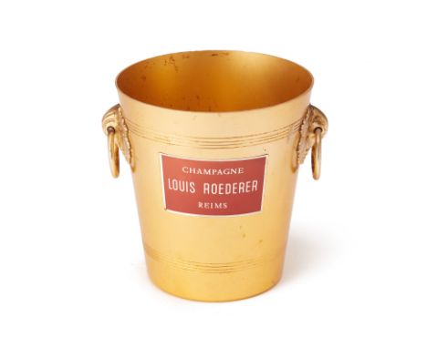 A LOUIS ROEDERER CHAMPAGNE BUCKET
Gilt metal with twin ring handles and label to front
20cm high
Condition: Signs of wear and