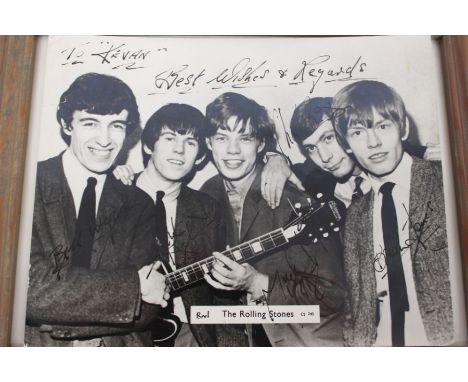 A Rolling Stones Signed Original Photograph. Autographed in full by the band. Signed in black pen by Bill Wyman, Keith Richar