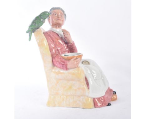 Royal Doulton – Pretty Polly – HN2768 – a hand painted ceramic figure / figurine of a lady with bowl of fish feeding parrot. 