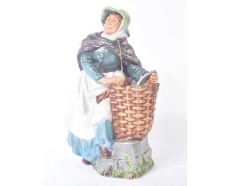 Royal Doulton – Old Meg – HN2494– a hand painted matt ceramic figure / figurine of a lady with fish in basket. Maker’s marks 