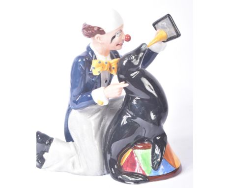 Royal Doulton – Partners – HN3119 – a hand painted ceramic figure / figurine of a circus clown and seal. Maker’s marks to bas