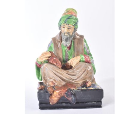 Royal Doulton – The Cobbler - HN1706 - a hand painted ceramic figure / figurine of a seated cross legged cobbler wearing a co