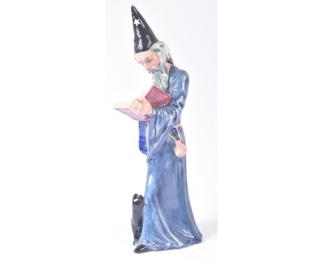 Royal Doulton – The Wizard - HN2877 (1978) – a hand painted ceramic figure / figurine of a Wizard reading his book of spells 