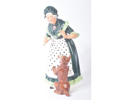 Royal Doulton – Old Mother Hubbard - HN2314 - a hand painted ceramic figure / figurine of Old Mother Hubbard feeding her dog 