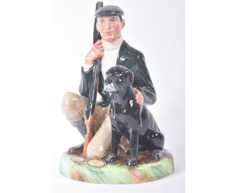 Royal Doulton – The Gamekeeper – HN2879 – a hand painted ceramic figure / figurine of a gamekeeper and dog on naturalistic pl