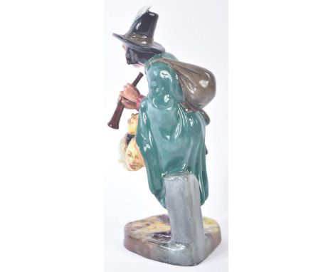 Royal Doulton – The Mask Seller – HN2103 – a hand painted ceramic figure / figurine of a mask seller with flute and sack. Mak