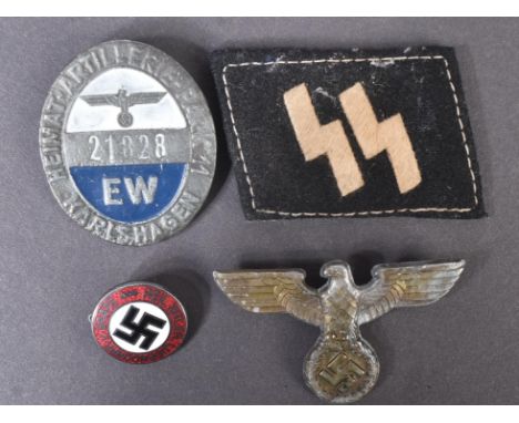 A collection of assorted WWII Second World War style Third Reich Nazi German interest badges and patches to include; NSDAP en