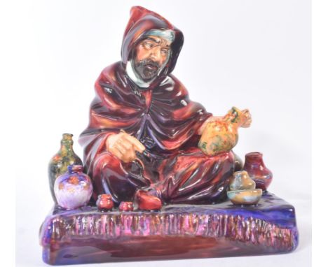 Royal Doulton – The Potter – HN1493 – a hand painted ceramic figure / figurine of an Arabic pot seller. Maker’s marks to base