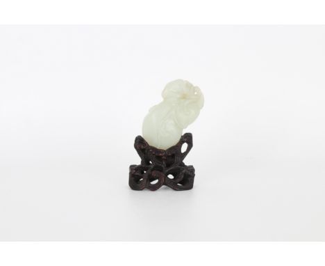A Chinese white jade group of monkey and fruit, with stand. Height: 2.75 in. (w/ Stand)