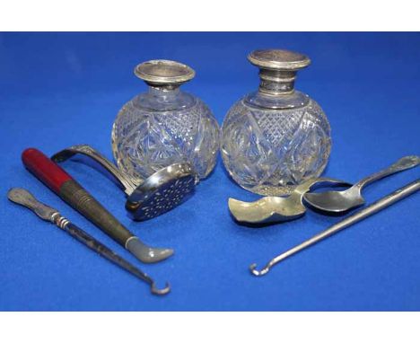 THREE SILVER HANDLED BUTTON HOOKS 
also three gloves stretchers, two silver mounted perfume bottles and a group of minor cutl