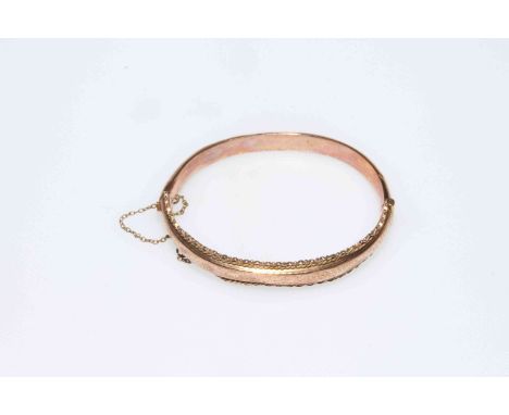 Late Victorian 9 carat gold part engraved bangle.