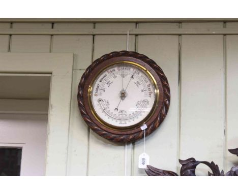 Circular oak rope twist barometer.