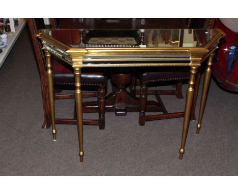 Gilt and mirrored shaped front console table.