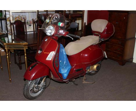 Paggio Vespa GTS 250IE Motor Scooter, 244cc petrol engine in red, Registration Number WA06 TBO.