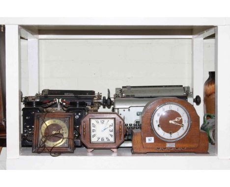 Two vintage typewriters, warming pan, mantel clocks, oak wall clock.