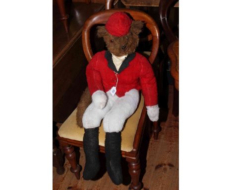 A mid 20th Century handmade fabric character model of a fox, dressed in full hunting livery, 78cm.