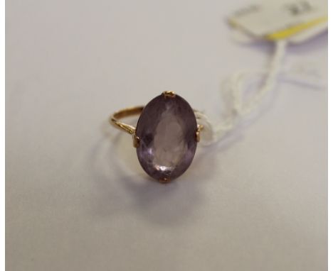 A gold coloured metal amethyst style ring, ring size R, some wear to face