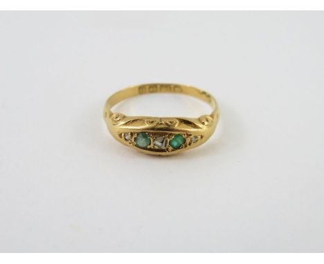 A rose cut diamond and emerald 18 carat gold ring, finger size K, 1.7g gross