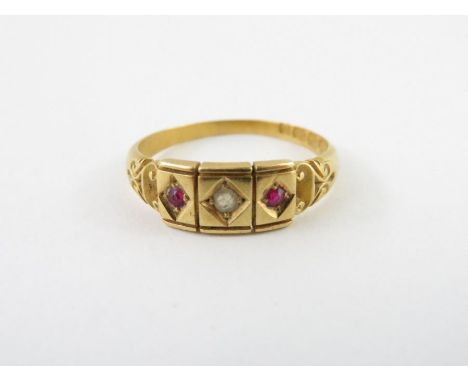 A late Victorian diamond and ruby 18 carat gold dress ring, Birmingham 1892, finger size S, 3.9g gross