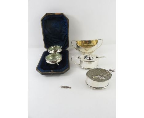 A cased pair of late Victorian silver salts, with spoons and clear glass liners; a silver mustard pot with liner; a silver sa
