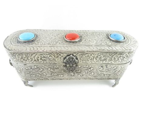 A Turkish metal scroll box, with ceramic insets to the hinged cover, 28.5 cm long