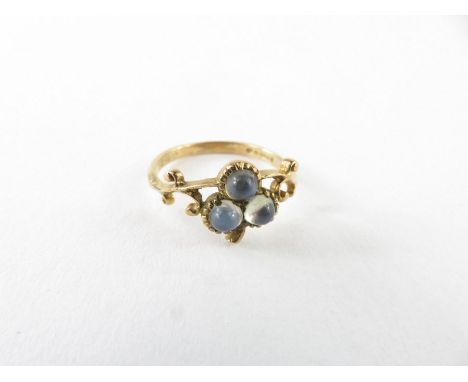 A 9ct gold moonstone ring, the three round cabochon cut moonstones in the form of a three leaf clover, with decorative should