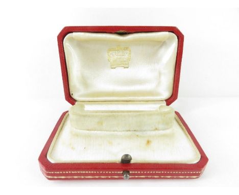 A vintage red leather Cartier watch box, 9.2cm x 6.1cm x 3.2cm