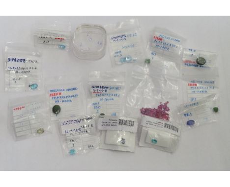 A collection of various loose gemstones to include ruby, tanzanite, appatite, chrome diaspore and others