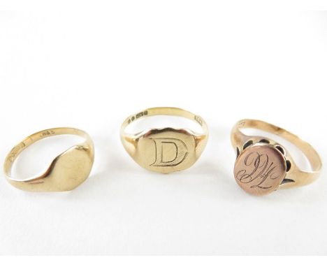 A 9ct gold signet ring with an octagonal head, Chester hallmark, finger size K 1/2; a 9ct gold signet ring with a shield shap