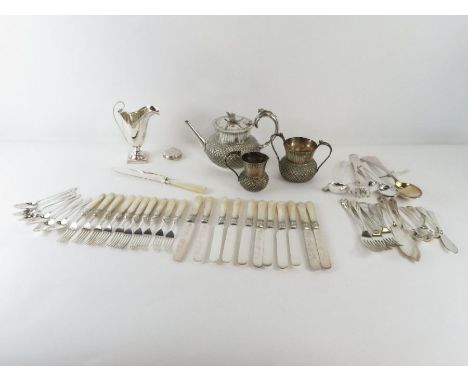A novelty electroplated three piece tea service in the form of thistle heads, with thistle handles; also a plated helmet shap