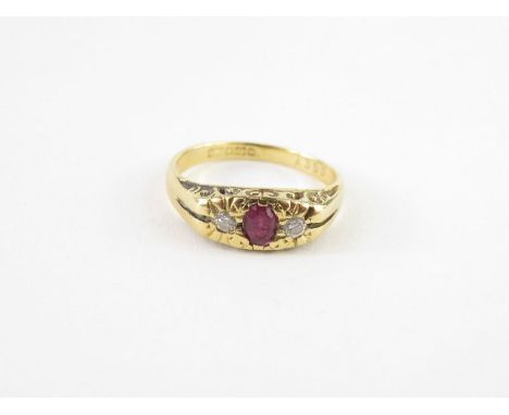 Am 18ct gold ruby and diamond ring, in the Victorian style, the oval ruby approximately 4.2mm x 3.2mm, the two diamonds appro