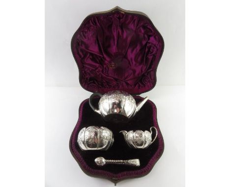 A cased Victorian silver three piece bachelor tea service, W&amp; J Barnard, London 1887, of almost bullet shape, with foliat