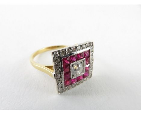 A ruby and diamond square shaped cluster ring, the central round brilliant cut diamond approximately 3.7mm, surrounded by a r