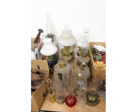 A collection of 19th century and later oil lamps and oil lamp parts