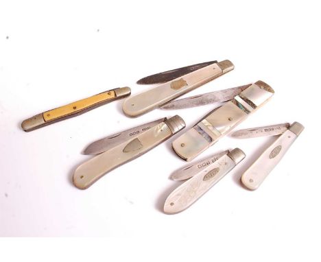 A silver and mother of pearl mounted pocket fruit-knife; together with three other examples in silver and mother of pearl; on