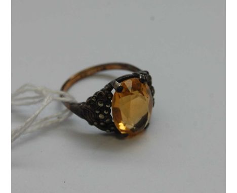 A 9ct gold and silver citrine set dress ring; together with a silver and amethyst set dress ring (2)