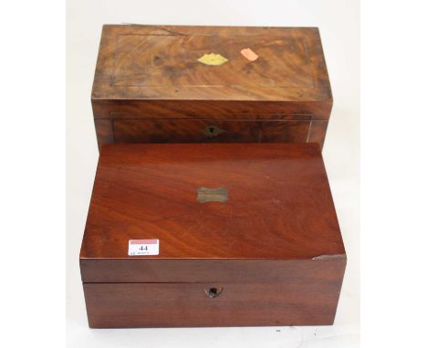 A Regency brass inlaid flame mahogany twin compartment tea caddy, of rectangular form, standing on four turned wooden disc fe