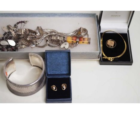 A collection of silver and other jewellery to include an amber set dress ring, a silver torque bangle and a silver gatelink b