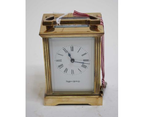 A lacquered brass cased carriage clock, having an enamelled dial with Roman numerals, signed Mappin &amp; Webb, with visible 