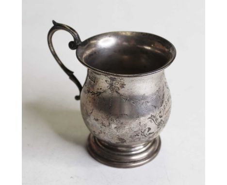 A George V silver bell-shaped tankard, engraved with flowers and having a C-scroll handle, dated January 1914, 4.4oz